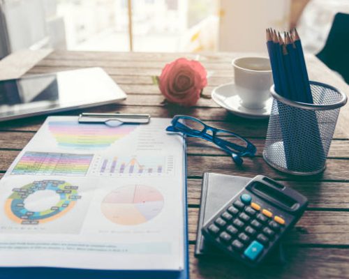 Excel graph with Spreadsheet Document showing Information Financial Startup Concept. Financial Planning making Accounting Database Report. Graphs and chart on screen with stationery set business stuff