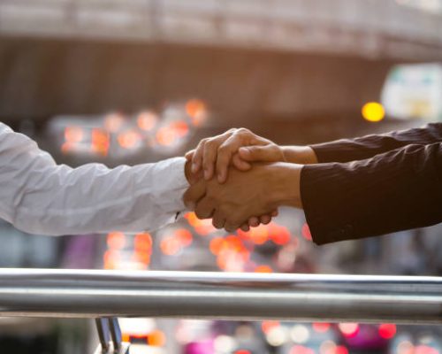 Business trust commitment which Business Partners holding hands,Help, trust ,support ,empathy and factors relationship marketing for reach successful achievement,Trust and commit concept.